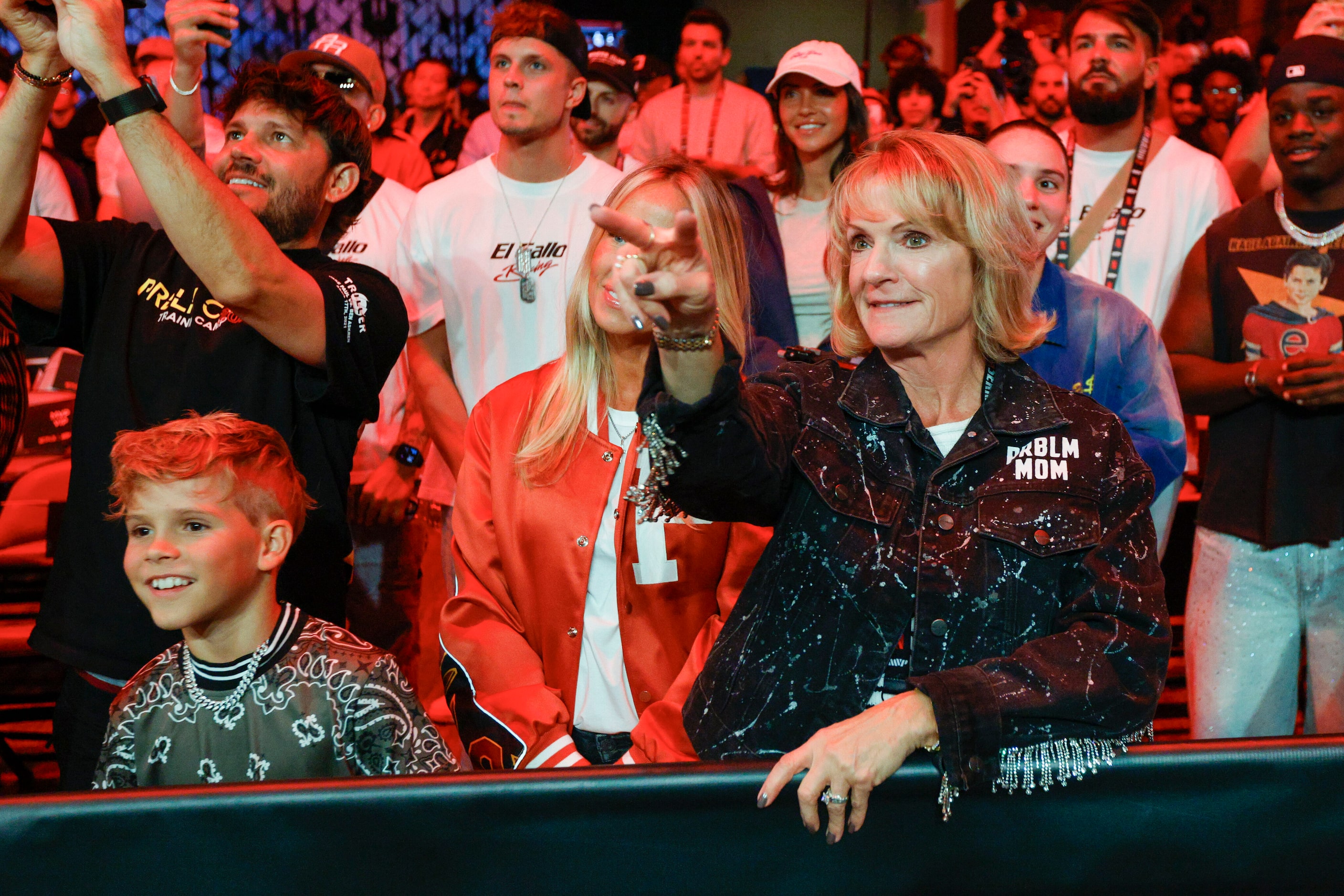 Jake Paul’s mom Pam Stepnick points to her son in the ring as he’s interviewed after an open...