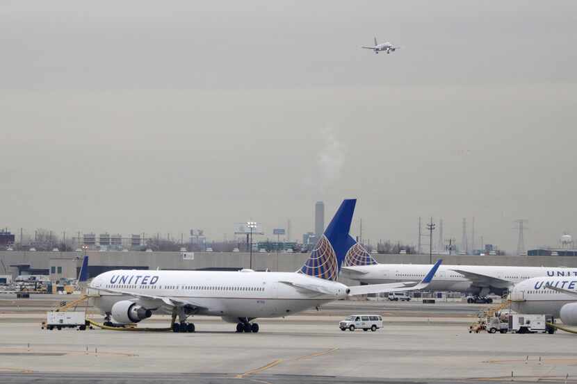 In this Wednesday, Jan. 23, 2019 file photo, United Airlines jets are seen as a plane...