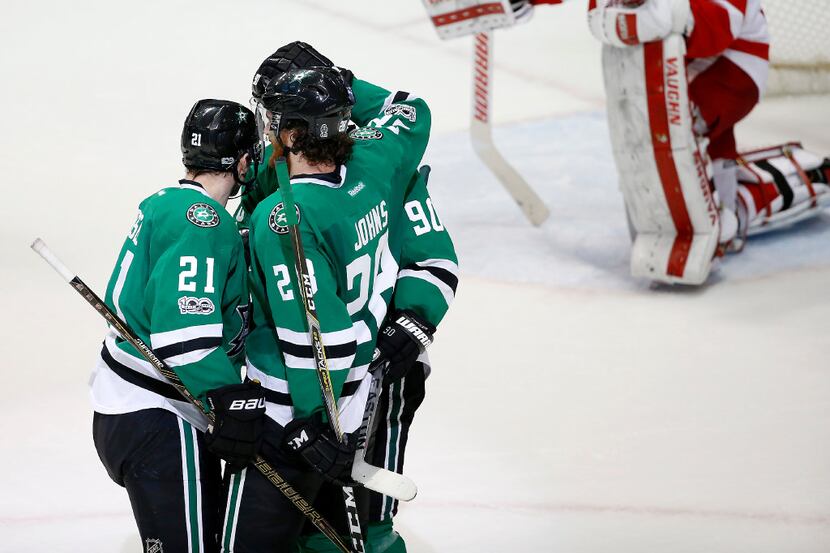 Dallas Stars defenseman Stephen Johns (28) is congratulated by left wing Antoine Roussel...