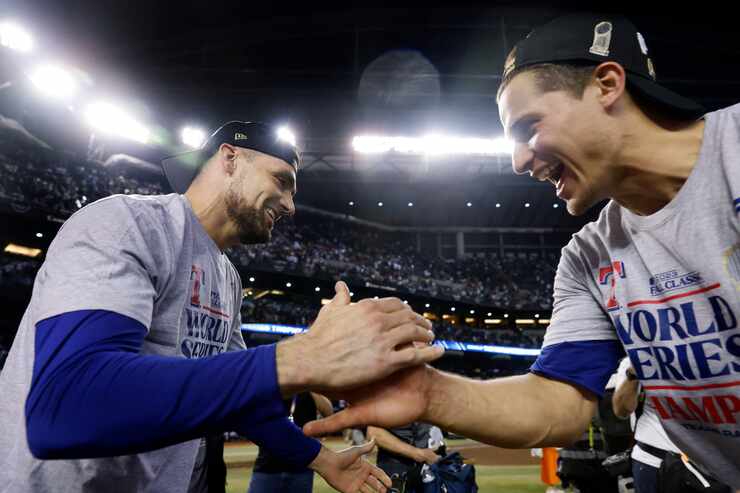 Texas Rangers starting pitcher Nathan Eovaldi (left) and shortstop Corey Seager celebrate...
