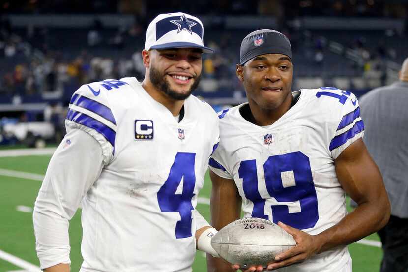 Dallas Cowboys quarterback Dak Prescott (4) and Dallas Cowboys wide receiver Amari Cooper...