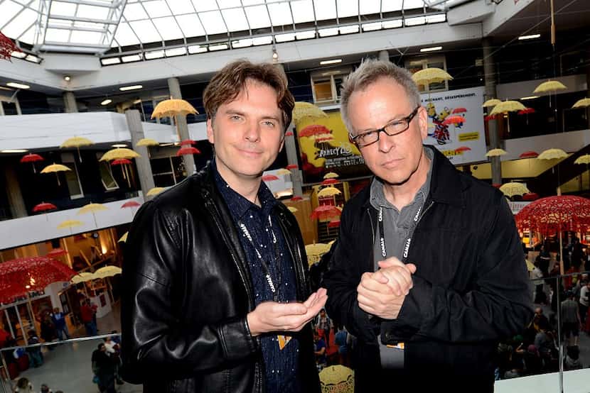 Byron Howard (L) and Rich Moore pose as they present Studios Disney's latest film Zootopia...