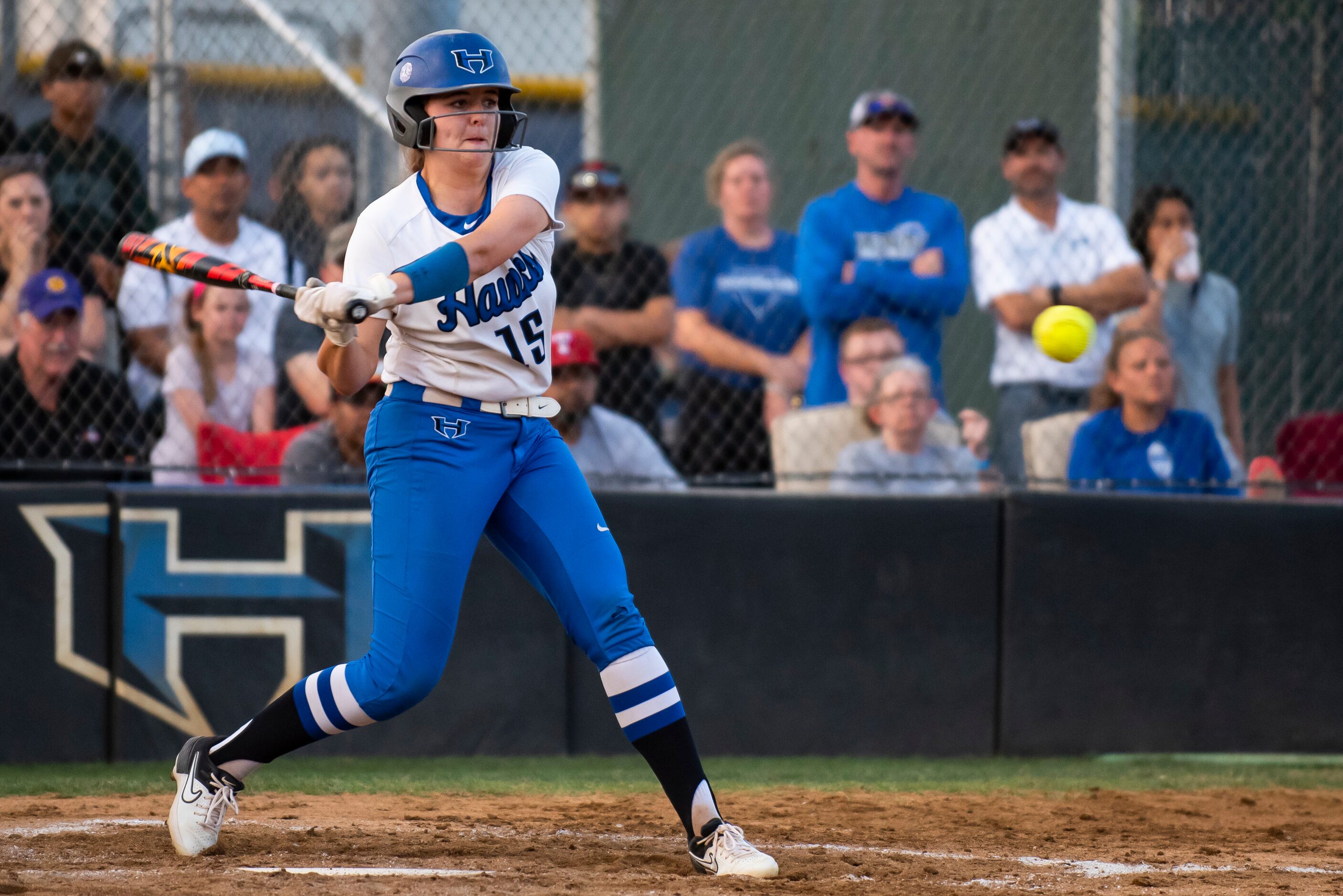 Hebron catcher Zoe Bowen (15) swings at a pitch during the District 6-6A title game between...