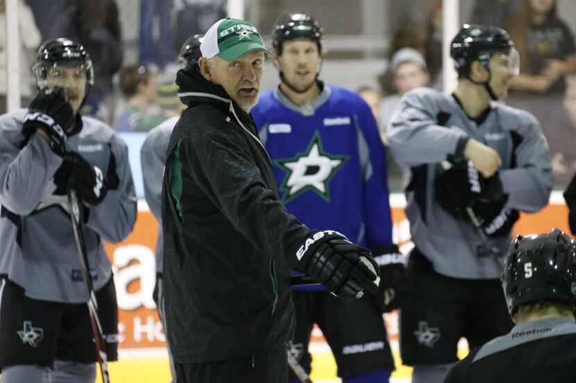 Dallas Stars coach Lindy Ruff talks with his players as the Dallas Stars hold their annual...