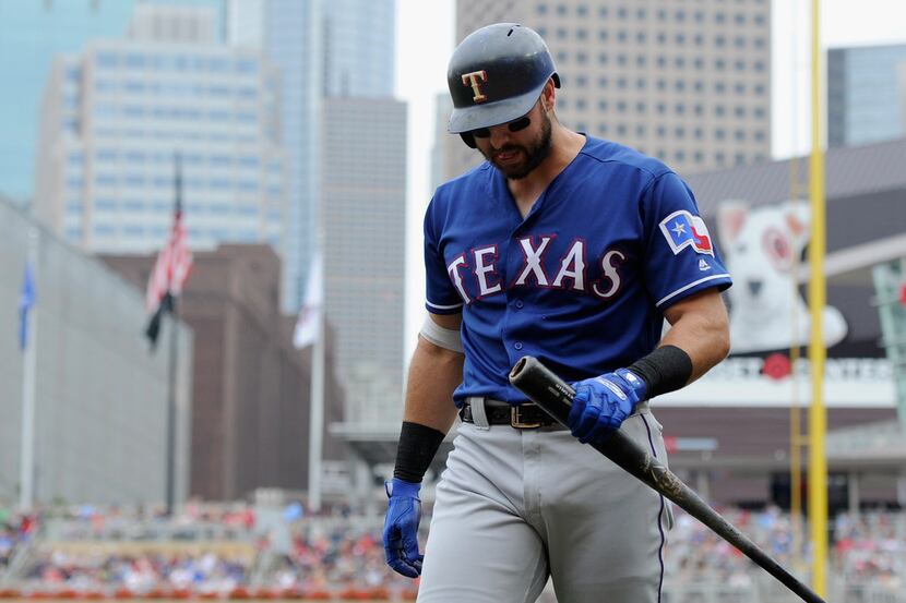 MINNEAPOLIS, MN - JUNE 24: Joey Gallo #13 of the Texas Rangers walks back to the dugout...