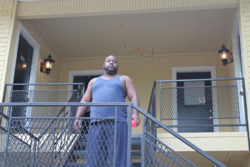 Oak Villas Apartments resident Lamarcus Jackson stands on the stairwell to his second-story...
