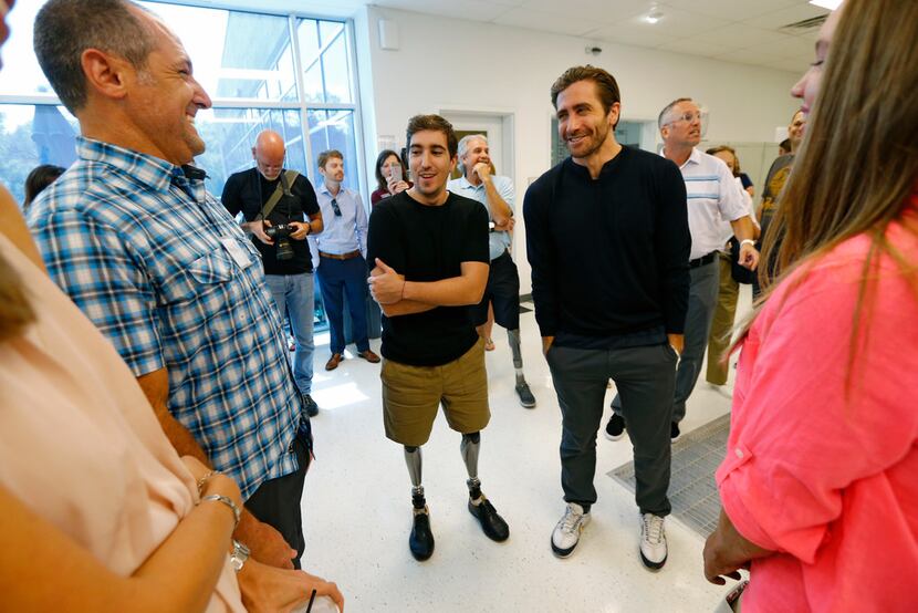 Michael Orlie (from left) talks to Jeff Bauman and Jake Gyllenhaal  with Keylee Latham, 14,...