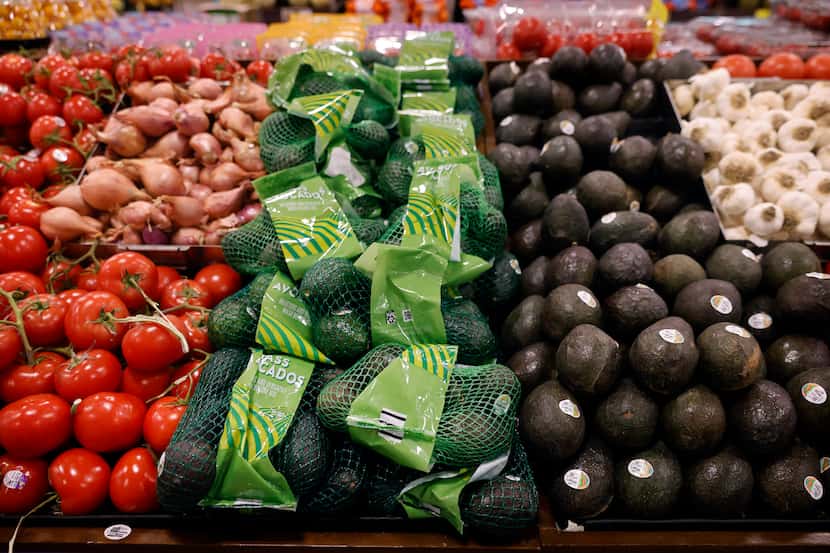 Avocados are displayed in the produce section of the Tom Thumb grocery store on Live Oak...