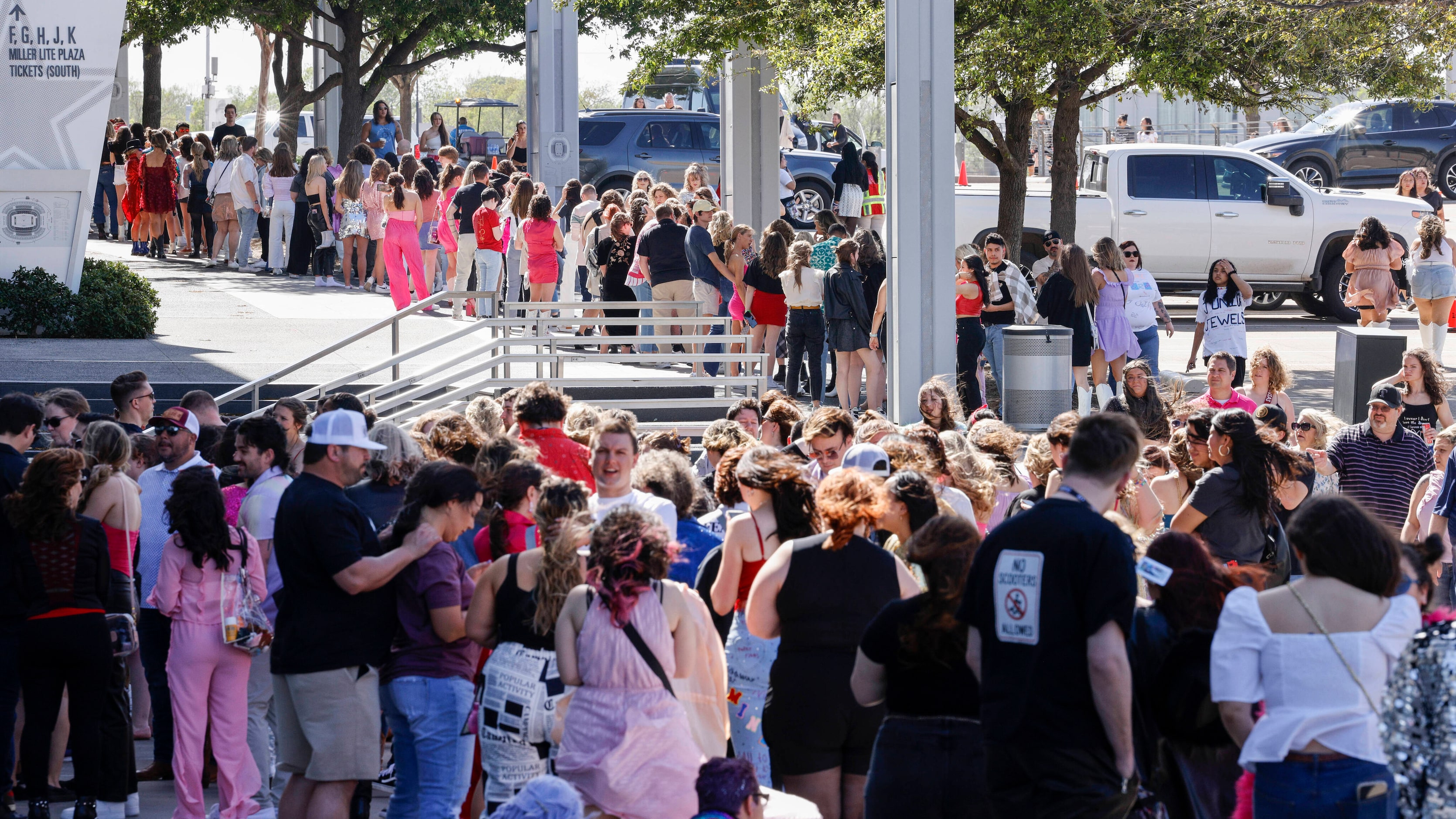 Hundreds of fans wait for doors to open before a Taylor Swift Eras Tour concert at AT&T...