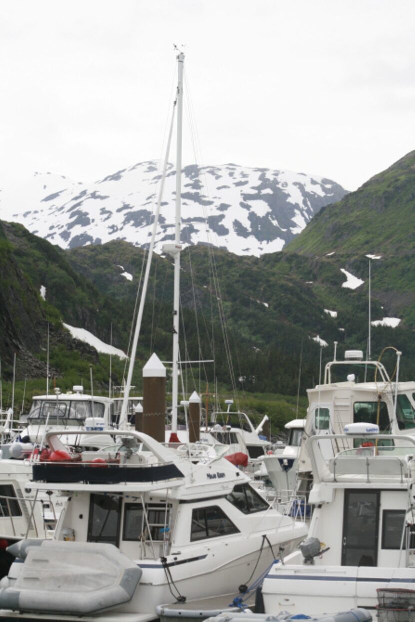 This photo taken July 9, 2012, shows boats in the harbor of the tiny community of Whittier,...