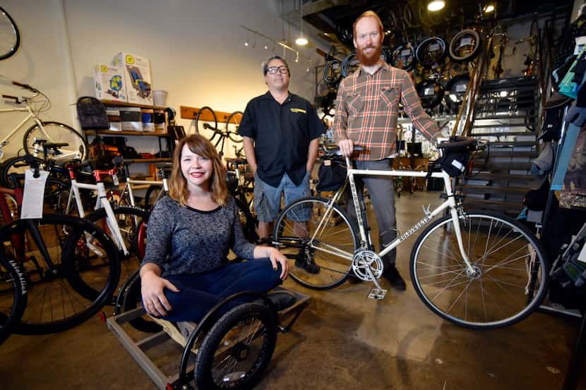Kristie Holt, co-owner of Local Hub Bicycle Co., service manager John Kendall and Mark Draz,...