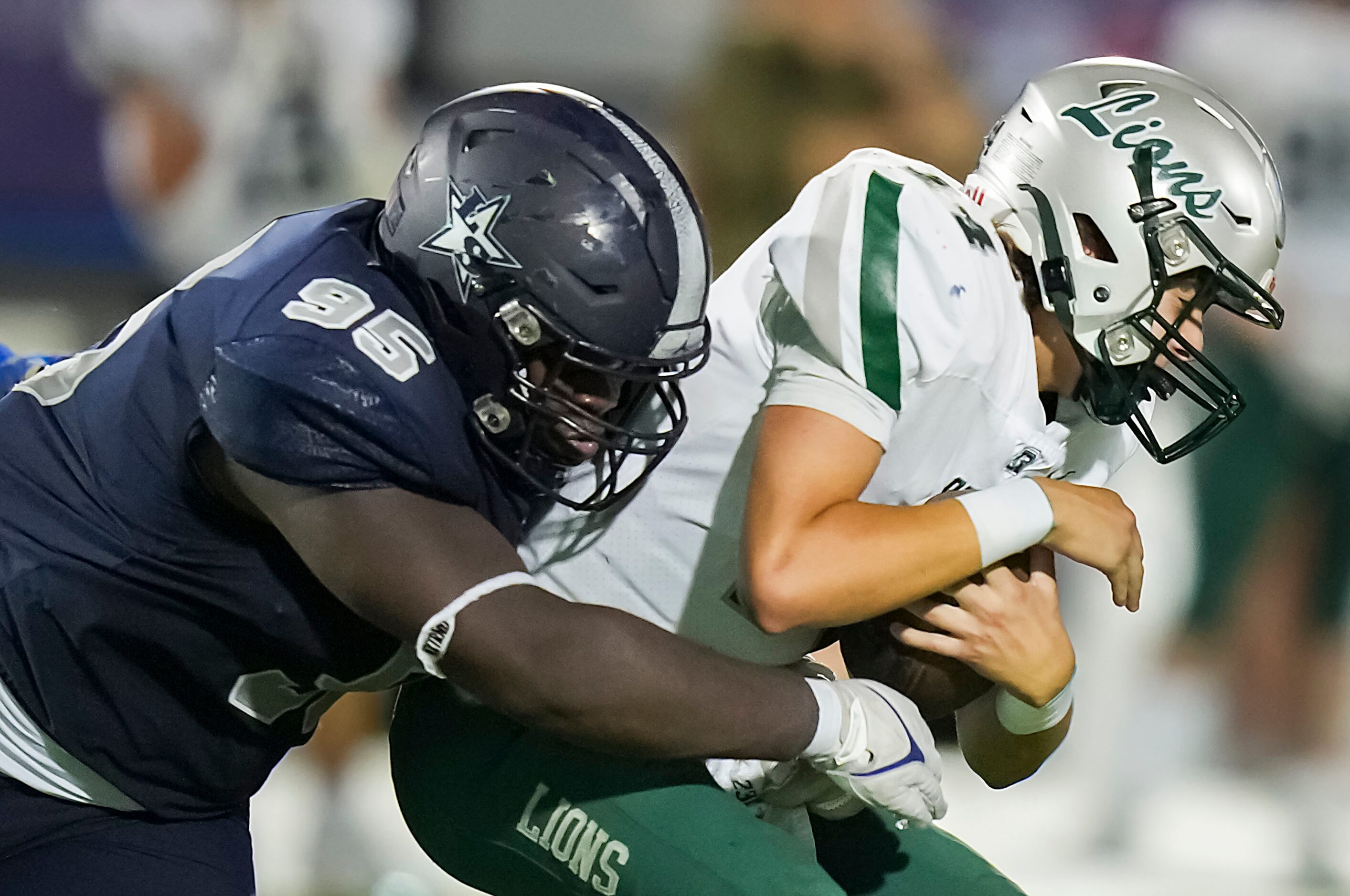 Frisco Reedy quarterback Braden Hernandez (14) is sacked by Frisco Lone Star defensive...