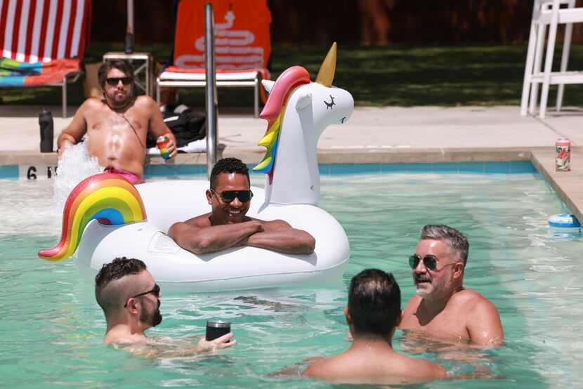 Moe MacDougall, 31, floats on a unicorn inflatable at Lee Harvey’s Dive In swimming pool. 