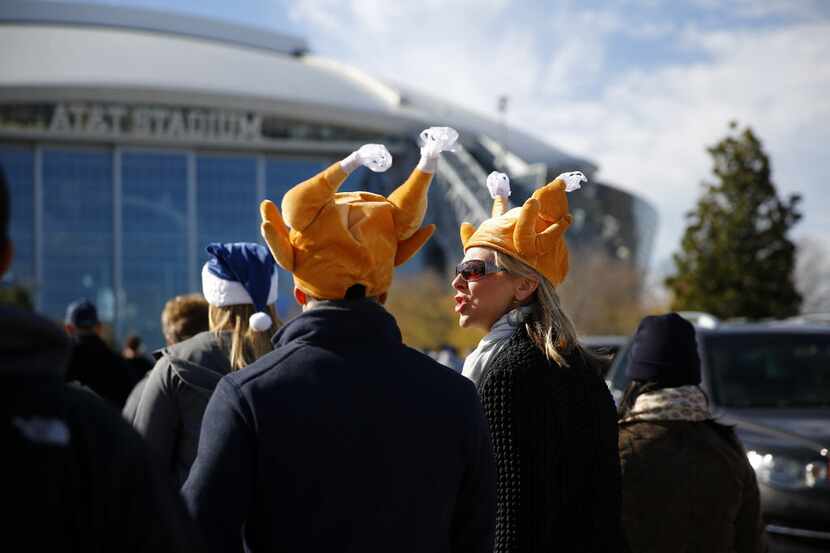 Duane Mungia and his wife Lisa wore their turkey hats to stay warm outside of AT&T Stadium...