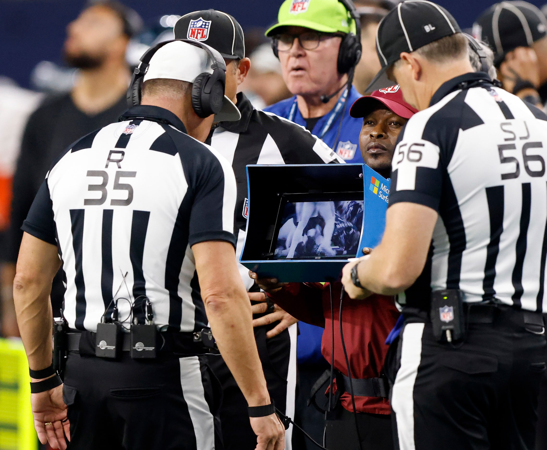 Referee John Hussey (35) reviews Dallas Cowboys running back Tony Pollard’s second quarter...