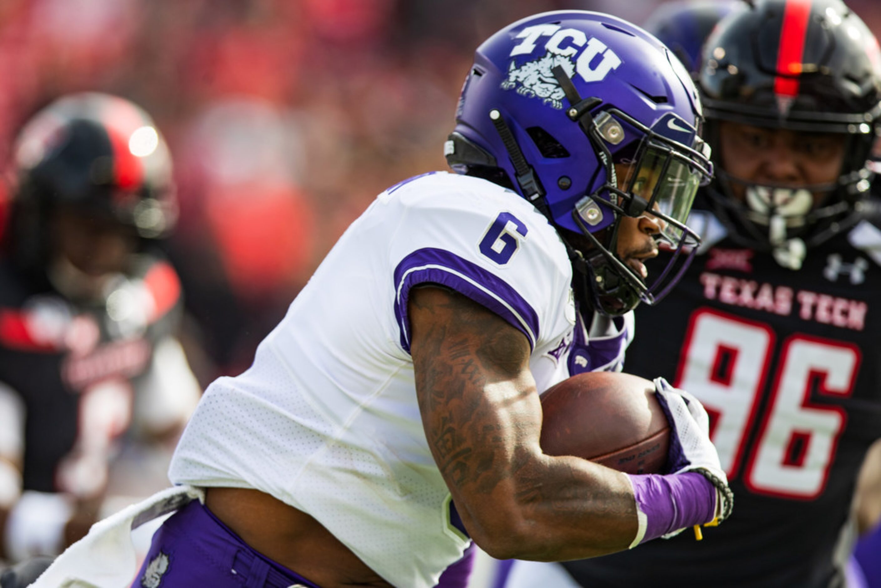 LUBBOCK, TEXAS - NOVEMBER 16: Running back Darius Anderson #6 of the TCU Horned Frogs runs...