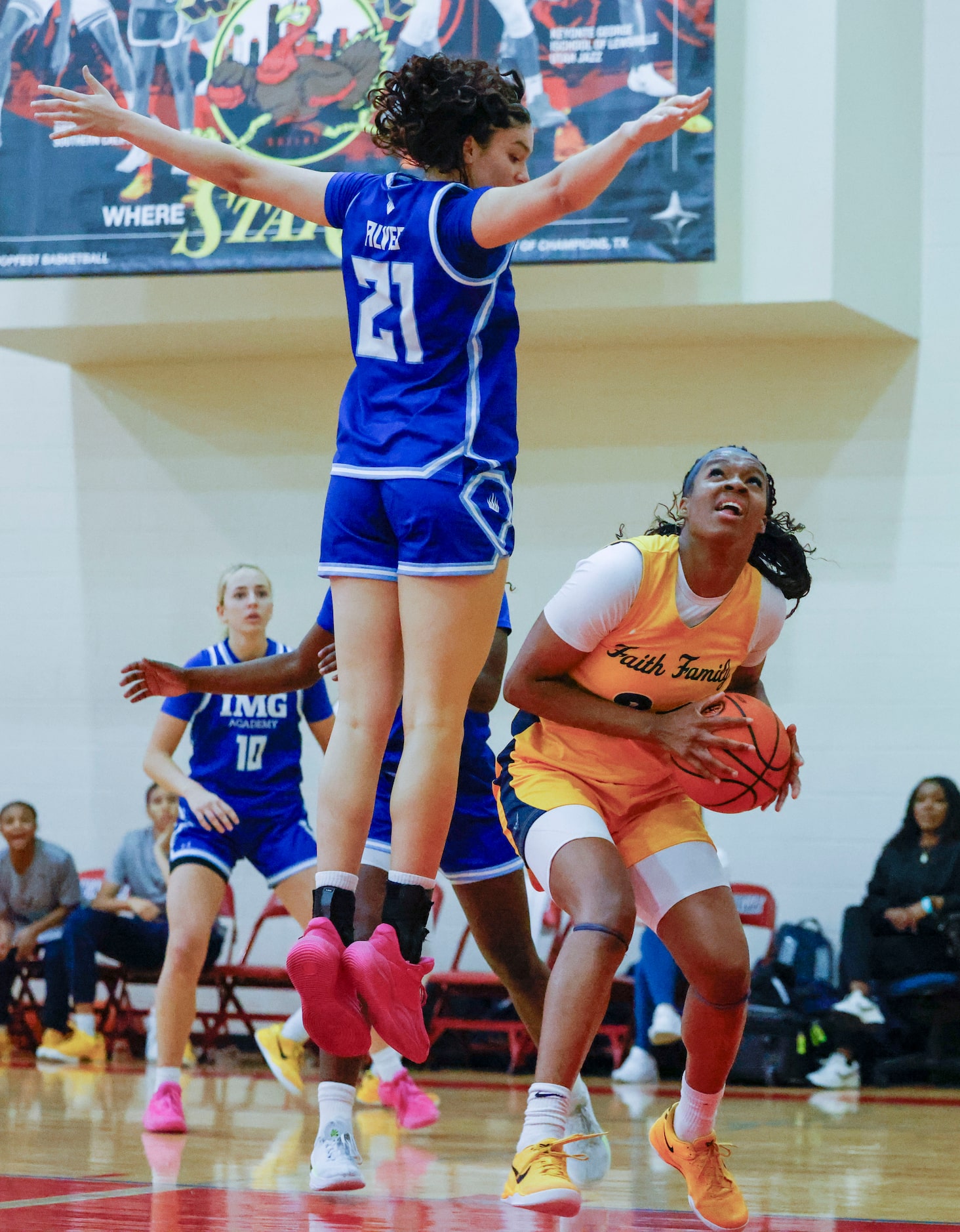 Oak Cliff Faith Family Academy’s Amari Byles (right) looks to shoot over IMG Academy’s...