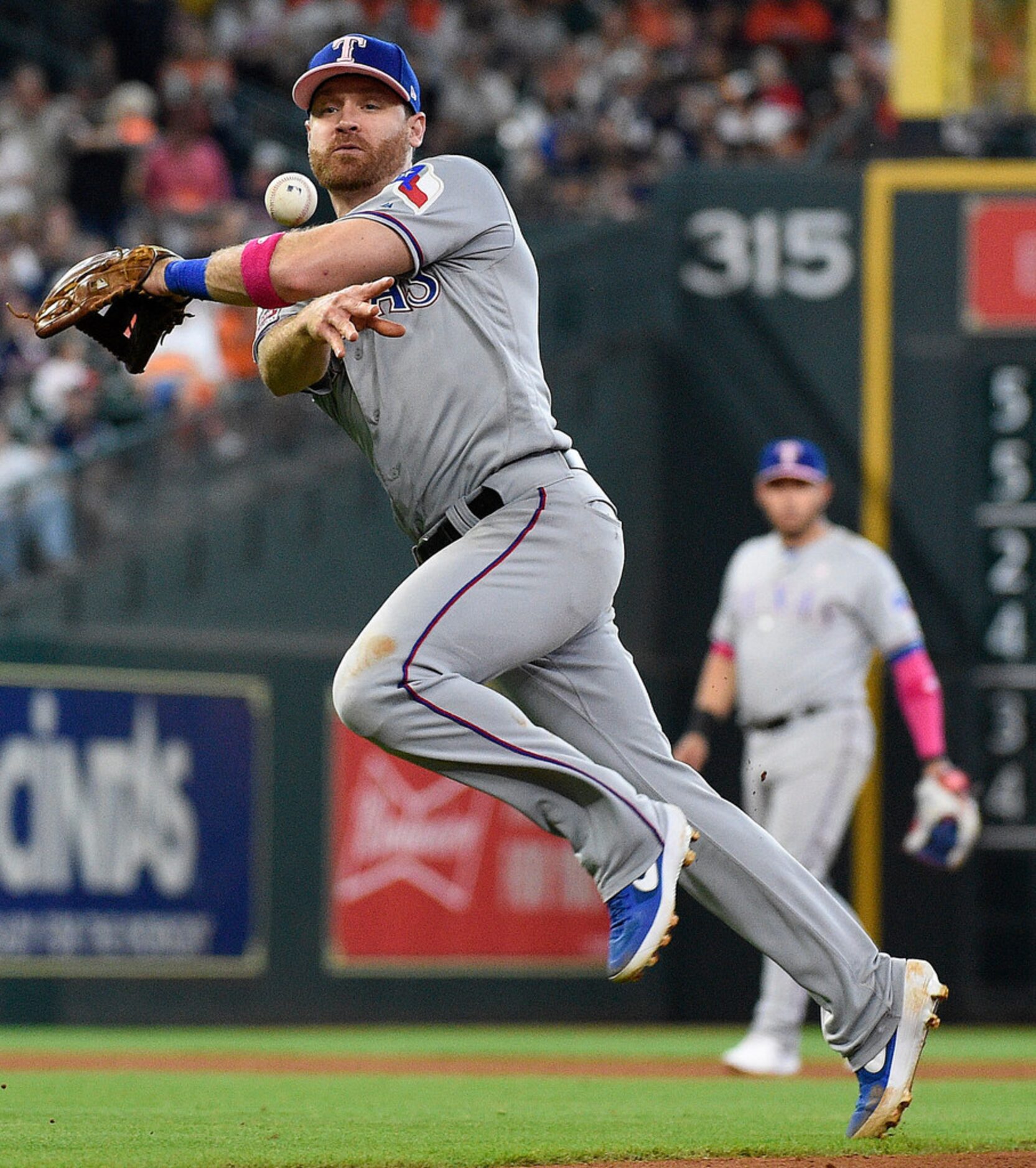 Texas Rangers second baseman Logan Forsythe attempts to throw out Houston Astros' Tony Kemp...