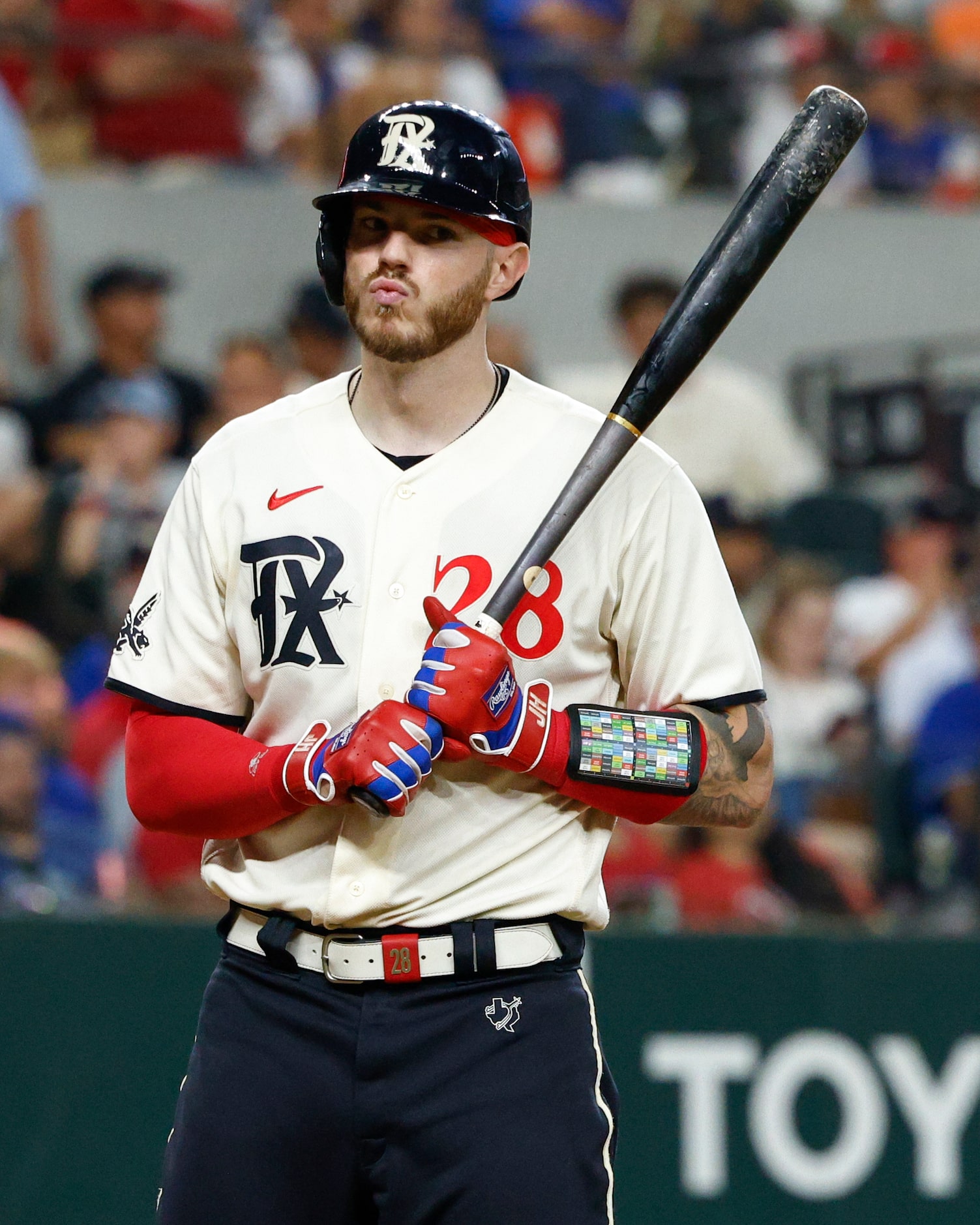 Texas Rangers catcher Jonah Heim (28) reacts after a called strike during the ninth inning...