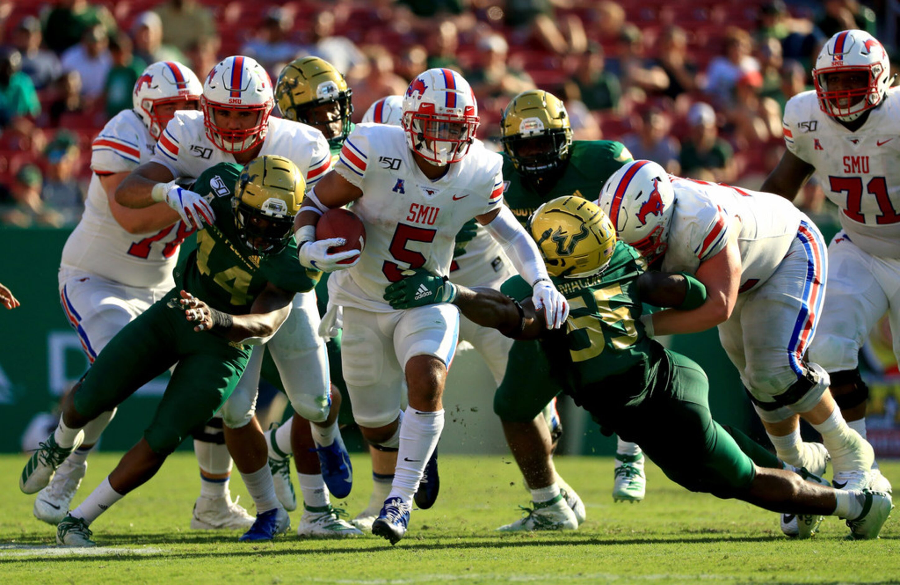 TAMPA, FLORIDA - SEPTEMBER 28: Xavier Jones #5 of the Southern Methodist Mustangs rushes...