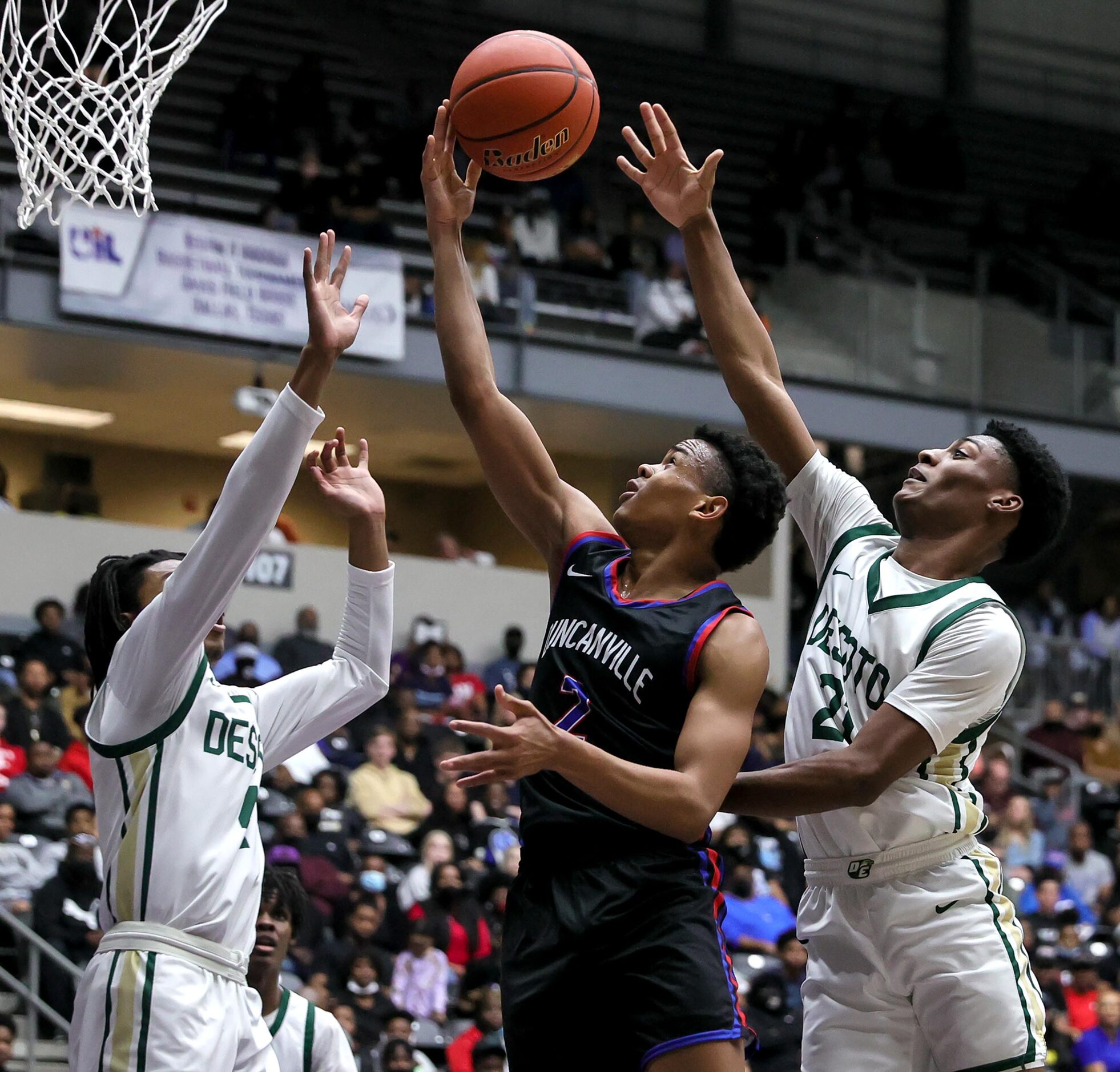 Duncanville guard Evan Phelps (2) goes to the basket against DeSoto forward Jaxxon Williams...