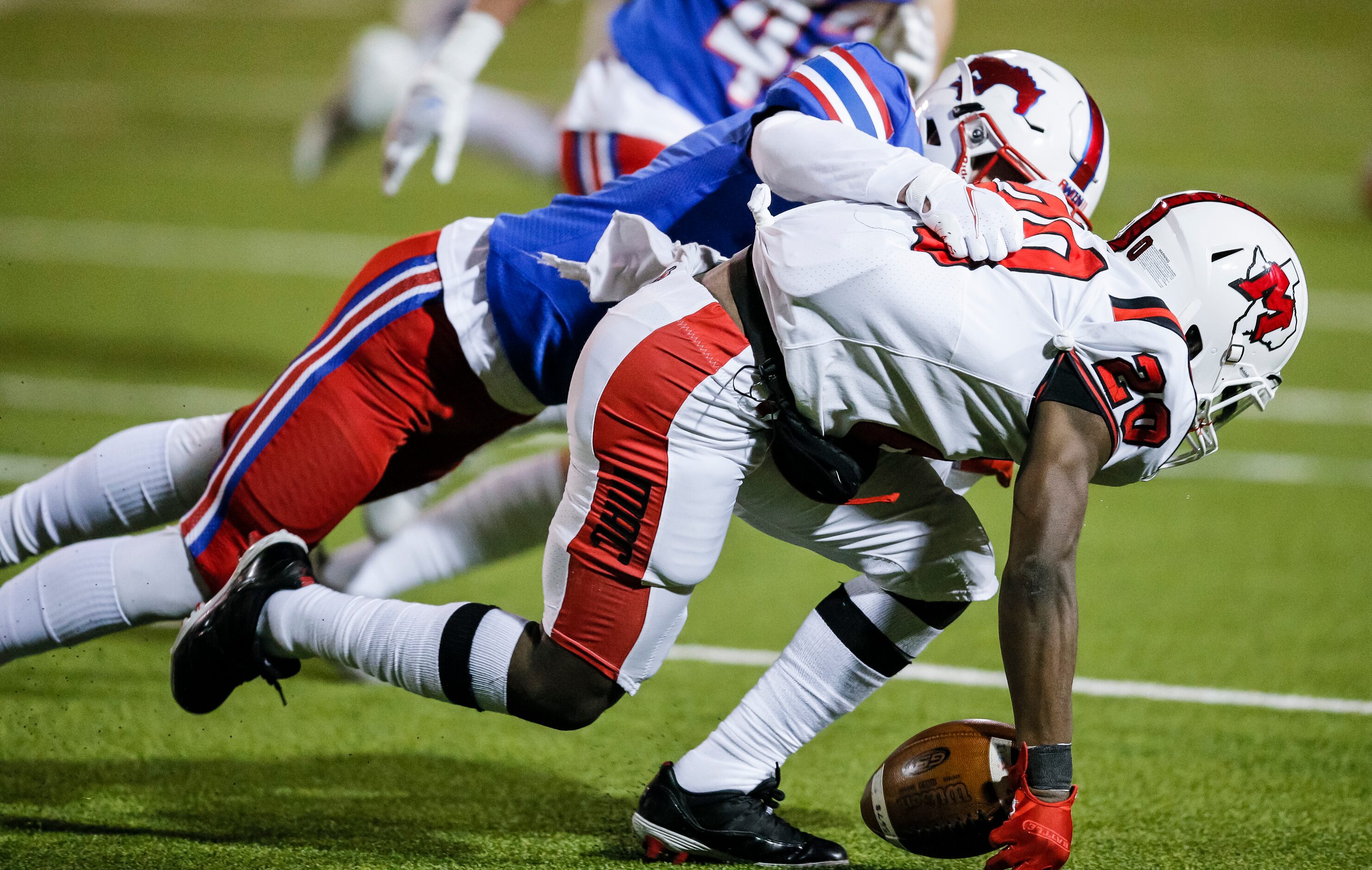 JJ Pearce junior safety Trent Williams (3) force Irving MacArthur freshman Darrelle Smith...