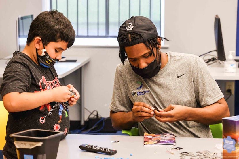 Lorenzo Reid-Deloatche works Jadin Torres, as part of the Children's Technology Program at...