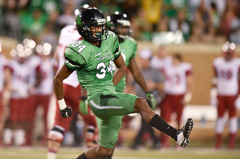 North Texas freshman defensive back Nate Brooks (34) celebrates after batting down a pass...