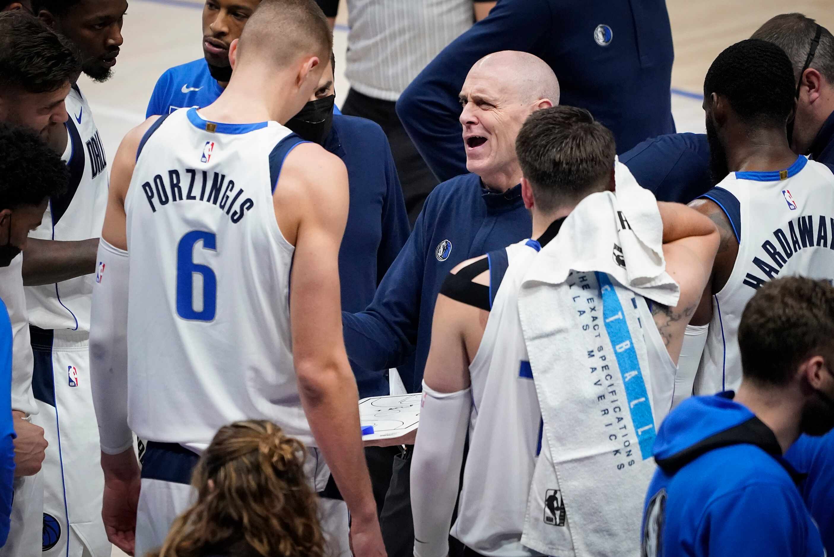Dallas Mavericks head coach Rick Carlisle talks with center Kristaps Porzingis (6), guard...