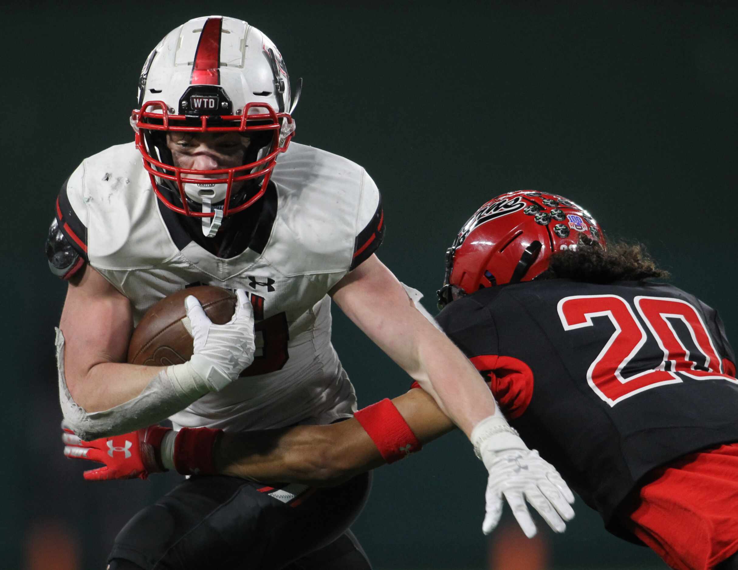 Rockwall Heath running back Preston Landis (30) rushes for a short gain before he is stopped...