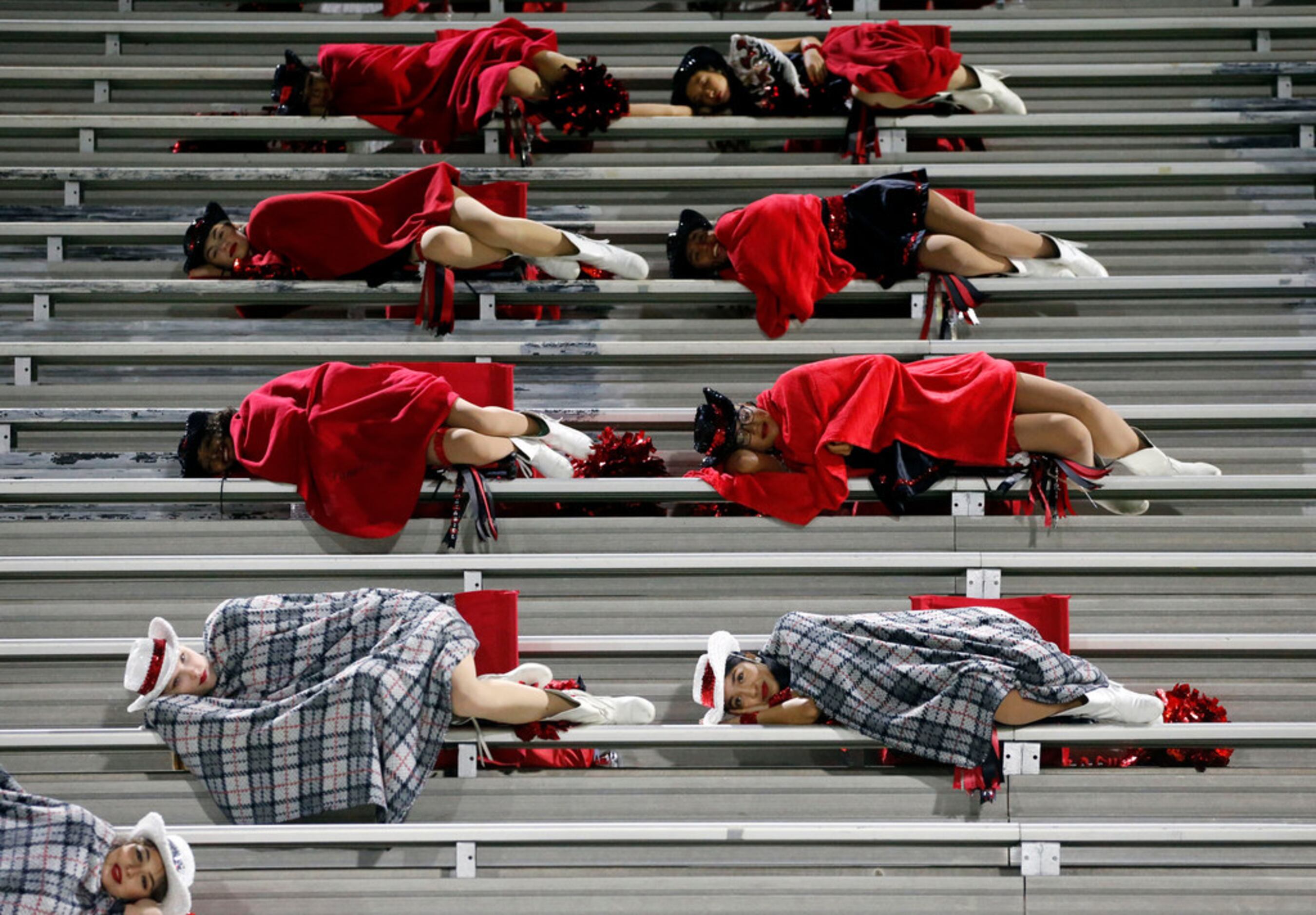 Members of Hillcrest High Panaders drill team feign sleep, while North Dallas High has the...