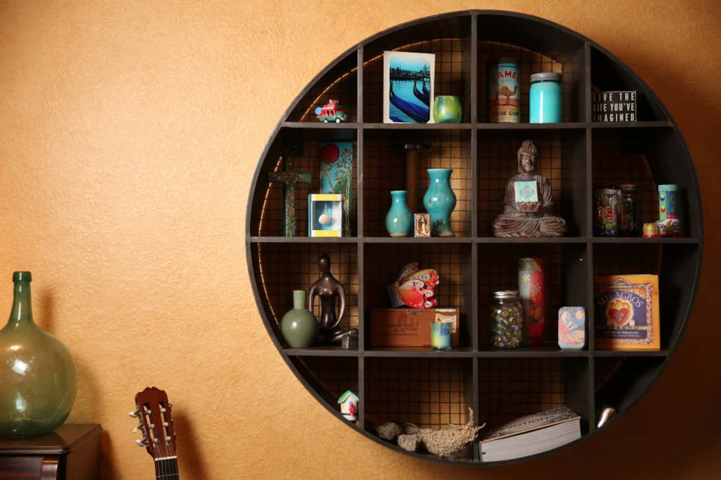 A shelf filled with trinkets inside Jill Allison Bryan's creativity space at her home in...