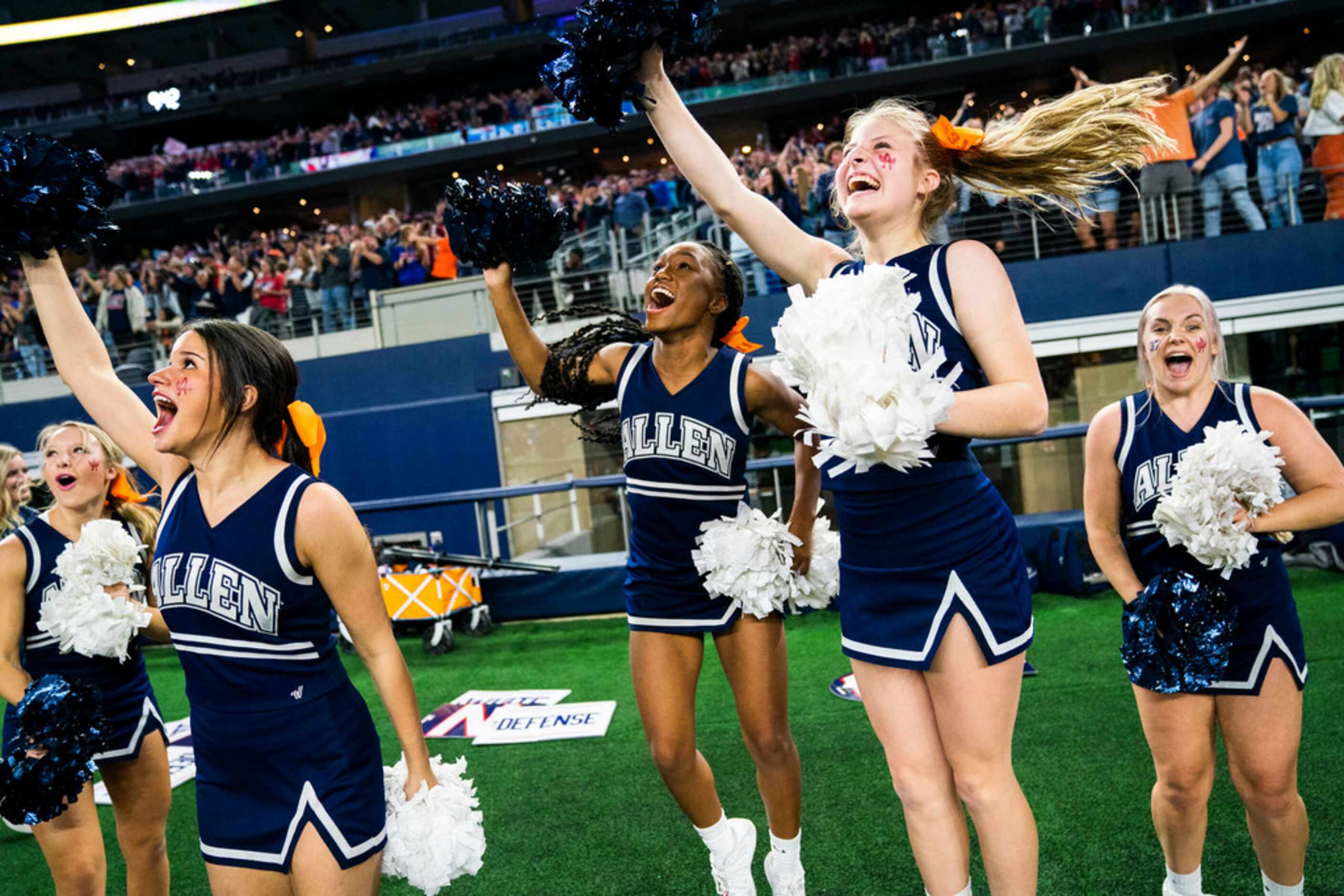 Allen cheerleaders celebrate a touchdown during the first quarter of a Class 6A Division I...