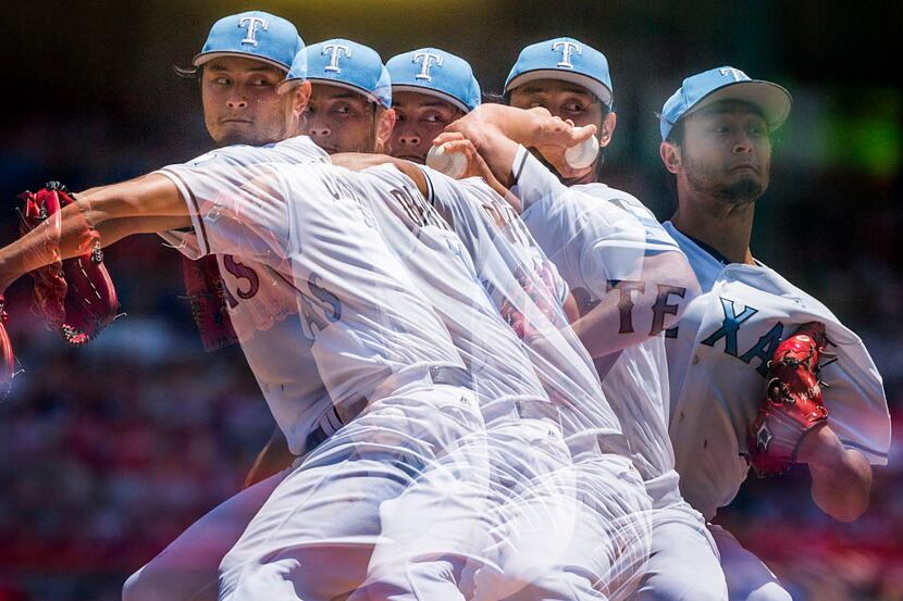 A multiple exposure photograph show Texas Rangers starting pitcher Yu Darvish as he pitches...