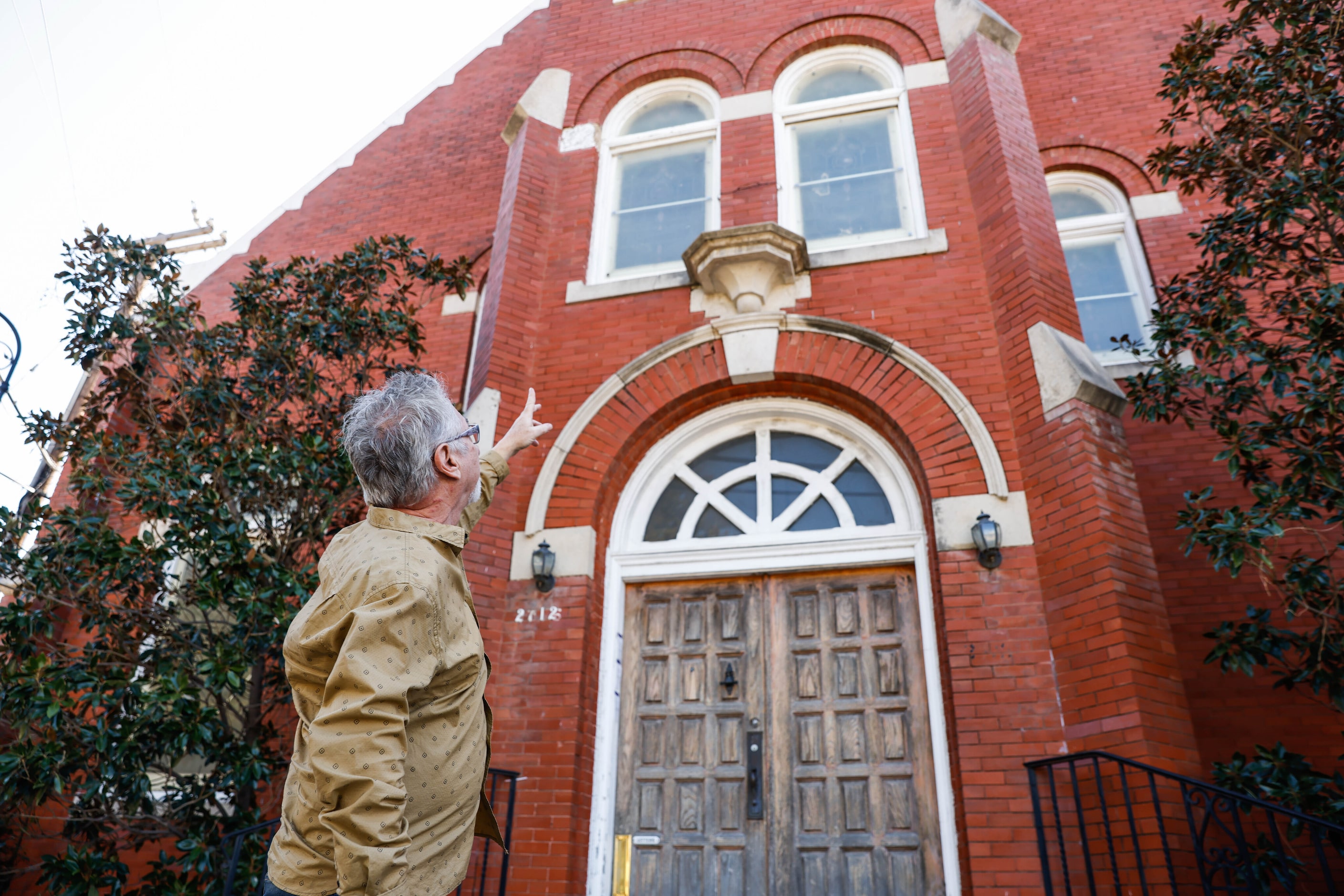 Jim Anderson points out damage at the former St Joseph’s Catholic Church in Old East Dallas.