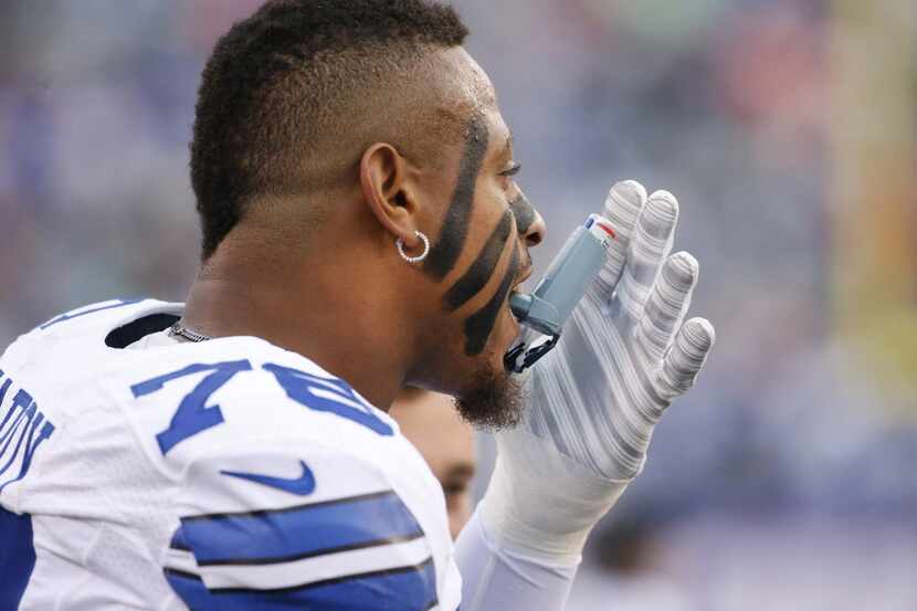 Dallas Cowboys defensive end Greg Hardy (76) uses an inhaler on the sidelines during the...