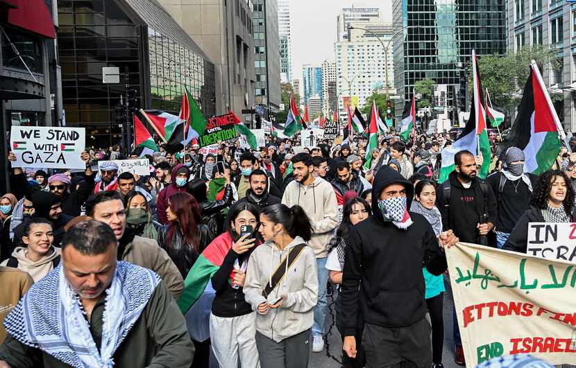 People take part in a protest for Palestine in Montreal, Sunday, Oct. 8, 2023. Hamas...