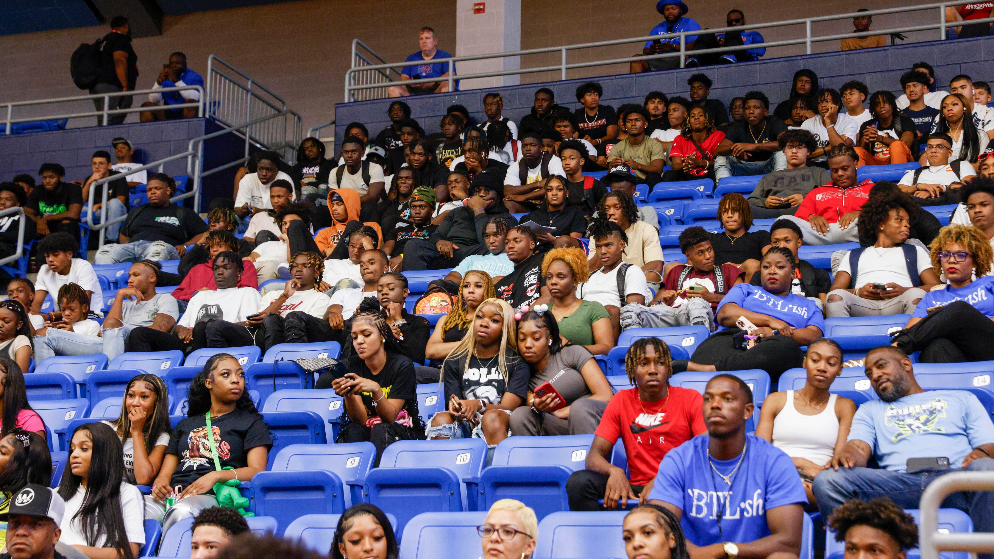 Students watch as Colin Simmons and Caden Durham make their college commitments during a...