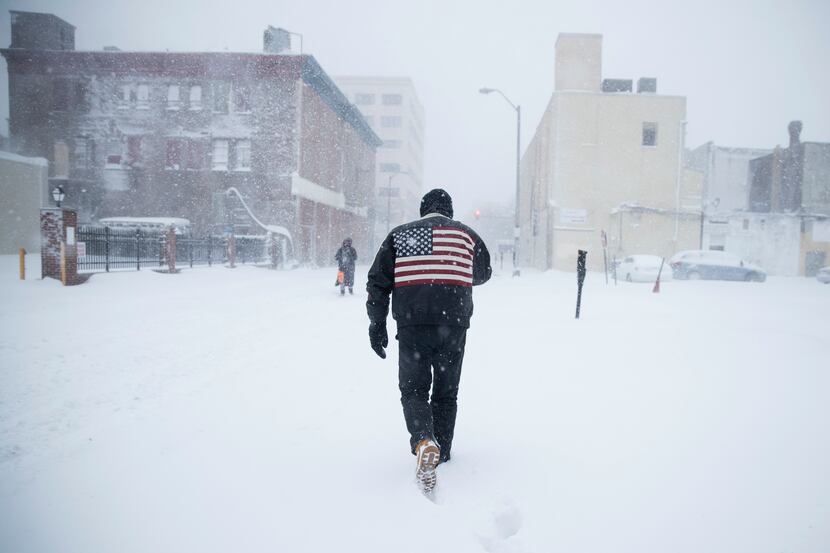 ATLANTIC CITY,  NJ: A man pushes his way through a winter snowstorm in Atlantic City, N.J.,...