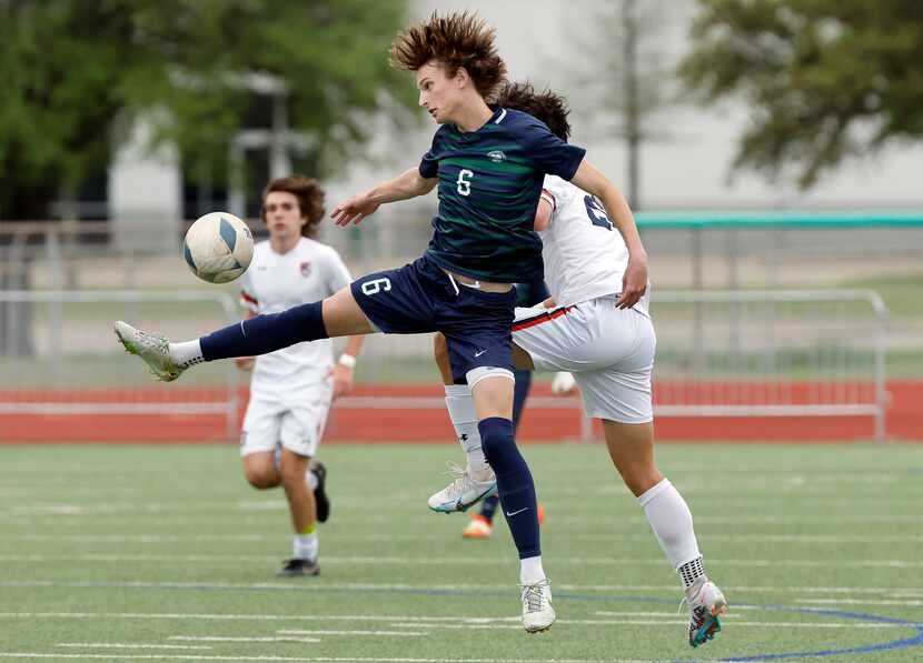 Frisco Reedy Trace Binyon (6) challenges McKinney North Ben Mulrooney (20) for the ball in...