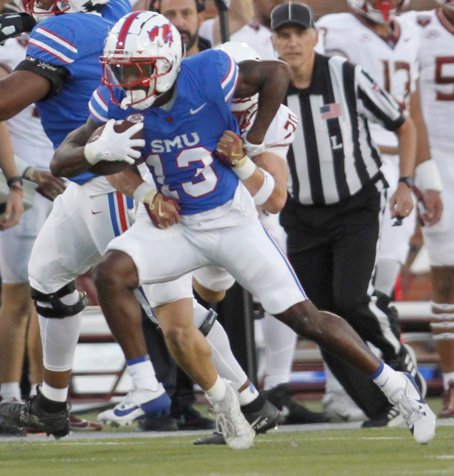 Southern Methodist University receiver Roderick Daniels Jr. (13) tacks on extra yardage...