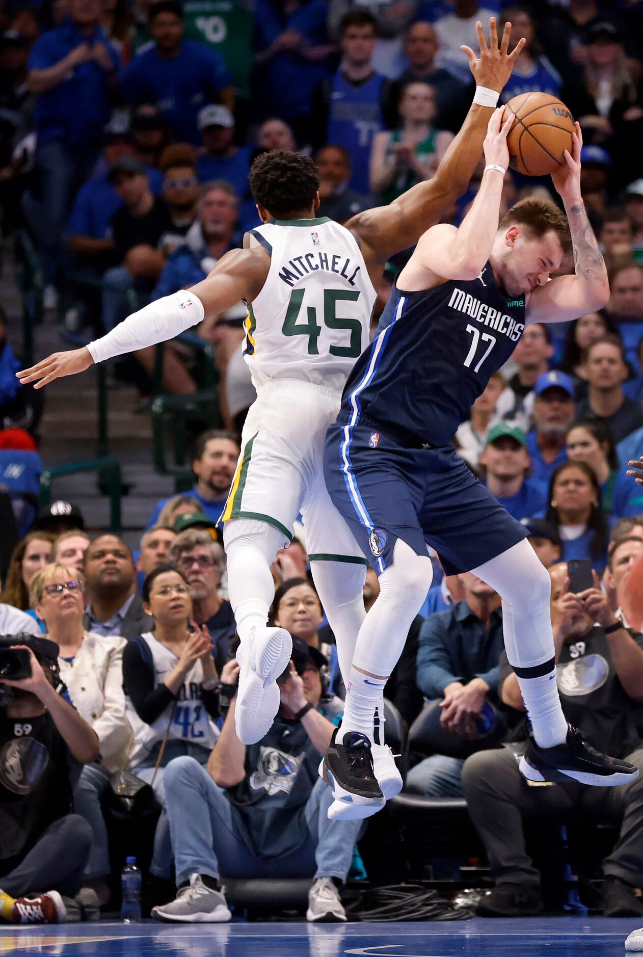 Dallas Mavericks guard Luka Doncic (77) pulls down a defensive rebound against Utah Jazz...