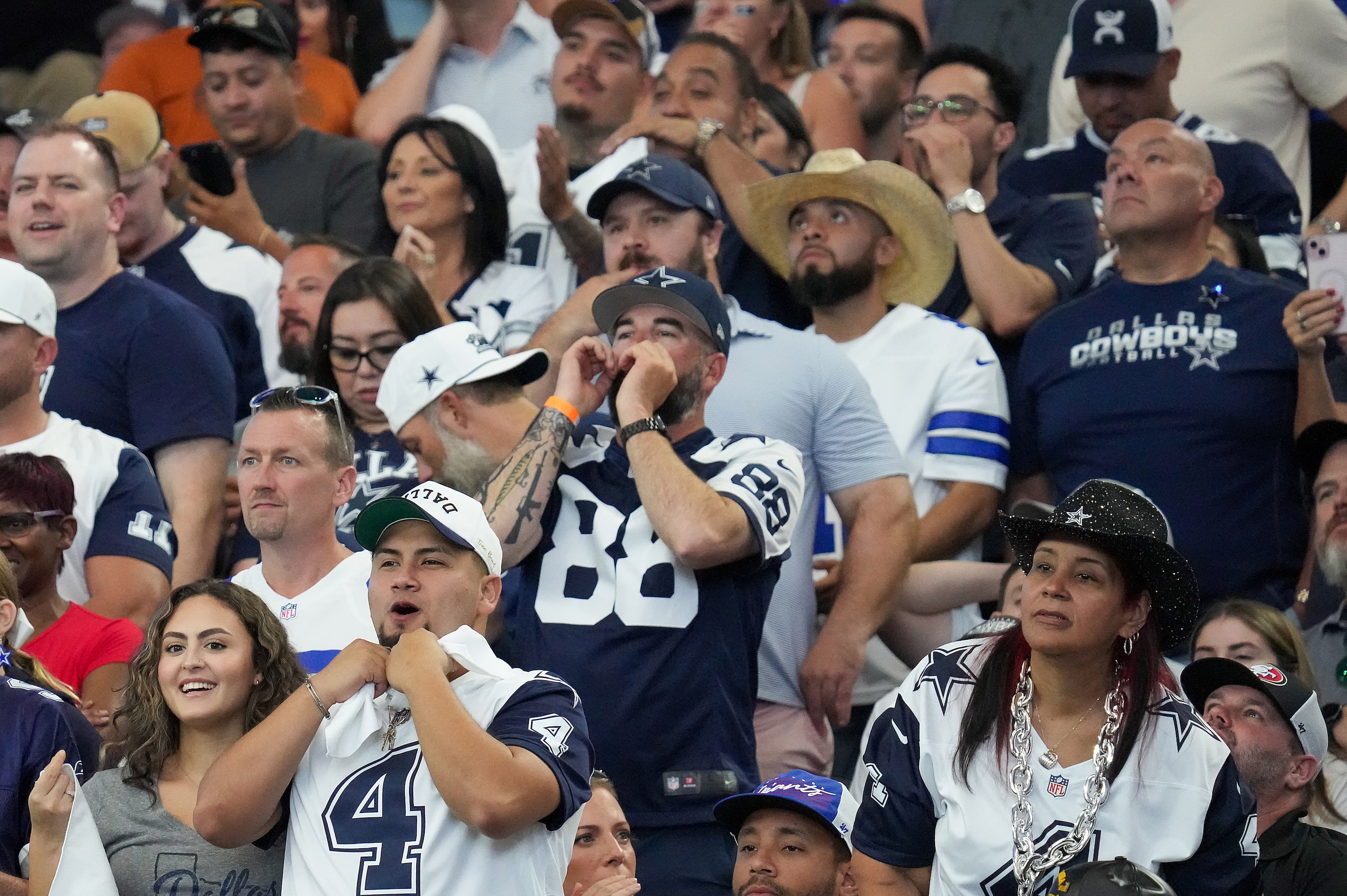 Dallas Cowboys fans boo after an incomplete pass by quarterback Dak Prescott during the...