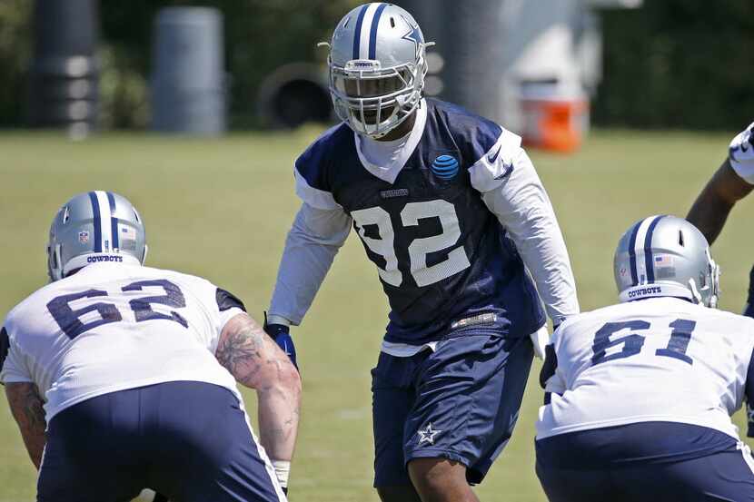 Dallas Cowboys defensive line Cedric Thornton (92) practices with Ryan Mack (61) and Jared...