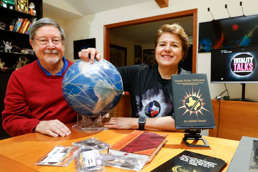 Solar eclipse enthusiast Leticia Ferrer and her husband, Daniel Brookshier, pose for a photo...