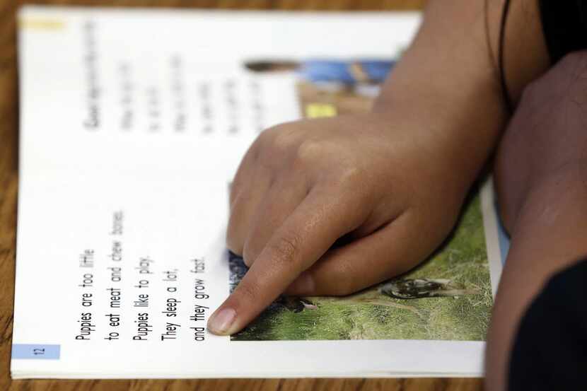 A student works on her multiple reading words and locating words in a dictionary exercise...