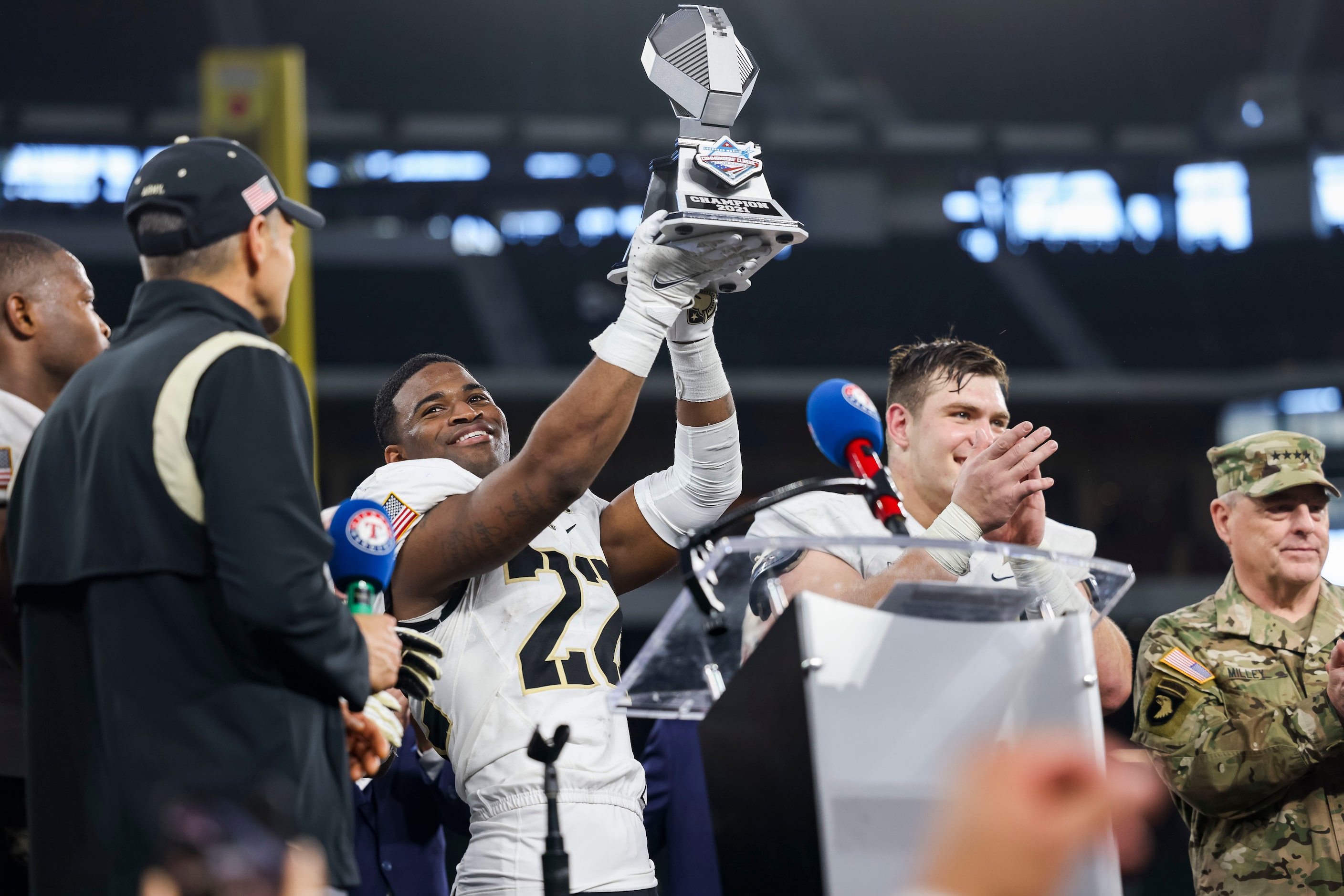 Army Black Knights defensive back Cedrick Cunningham Jr. (22) holds the trophy after winning...