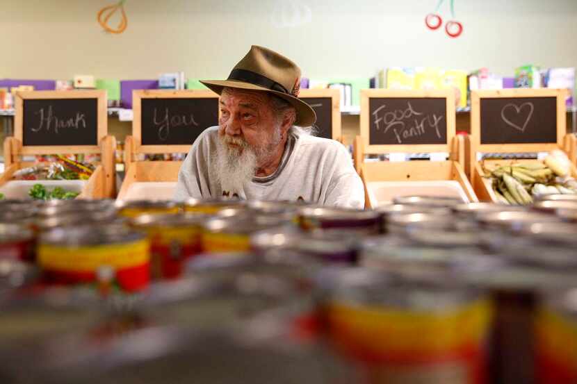 
Gary Holman shops in the food pantry at the Allen Community Outreach. The nonprofit has...