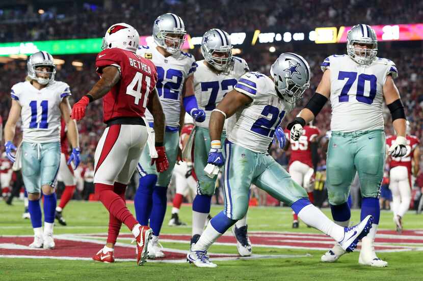 Dallas Cowboys running back Ezekiel Elliott (21) celebrates after scoring a rushing...