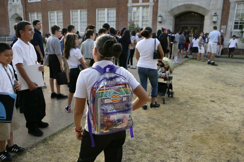  Students line up for entry last year at a school in Dallas Independent School District.